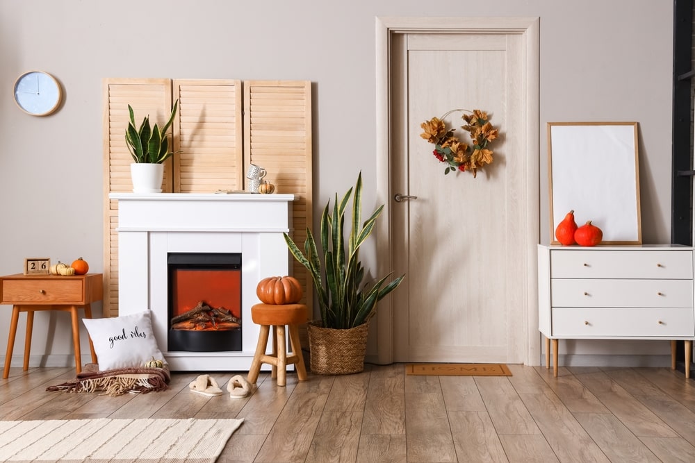 A fall-themed interior with a few houseplants. Fall is the time for bringing houseplants indoors for the winter