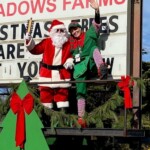 Santa and his elf at the marquee